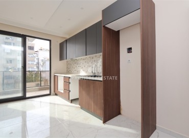 Двухкомнатные апартаменты, 55м². в современной резиденции с инфраструктурой, в районе Махмутлар, Алания ID-18854 фото-7