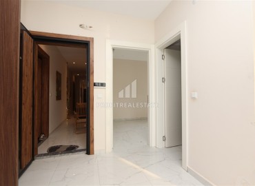 Двухкомнатные апартаменты, 55м². в современной резиденции с инфраструктурой, в районе Махмутлар, Алания ID-18854 фото-8