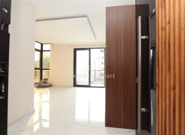 Двухкомнатные апартаменты, 55м². в современной резиденции с инфраструктурой, в районе Махмутлар, Алания ID-18854 фото-9