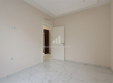 Двухкомнатные апартаменты, 55м². в современной резиденции с инфраструктурой, в районе Махмутлар, Алания ID-18854 фото-11