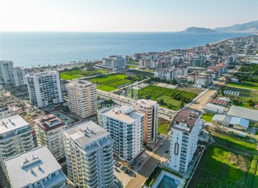 Трехкомнатная квартира, 100м², с дизайнерским интерьером, в комплексе с бассейном в 300м от моря в районе Алании - Махмутлар ID-18861 фото-19