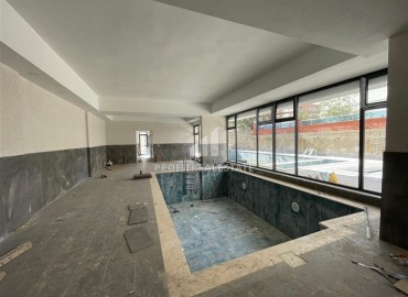 Двухкомнатная квартира, 60м², в новостройке 2025 года с бассейном в Махмутларе, Алания, в 150м от побережья ID-18887 фото-19