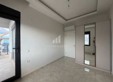 Новая двухкомнатная квартира, 55м², в новом комплексе с инфраструктурой у подножия гор в районе Оба, Алания ID-18895 фото-11