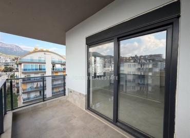 Новая двухкомнатная квартира, 55м², в новом комплексе с инфраструктурой у подножия гор в районе Оба, Алания ID-18895 фото-14