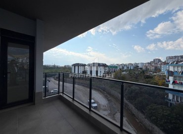 Новая двухкомнатная квартира, 55м², в новом комплексе с инфраструктурой у подножия гор в районе Оба, Алания ID-18895 фото-15