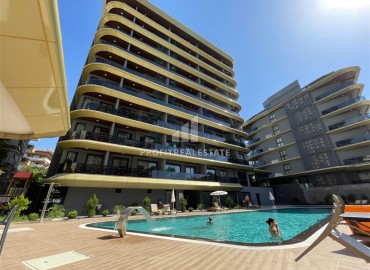 Двухкомнатные апартаменты, 55м², в резиденции премиум класса в центре Алании, в 350м от пляжа Клеопатры ID-17613 фото-1