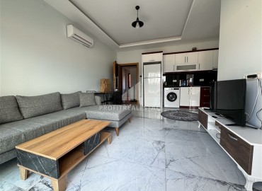 Уютная квартира с одной спальней, 55м² в современной резиденции с хорошей инфраструктурой в Махмутларе, Алания ID-18920 фото-2