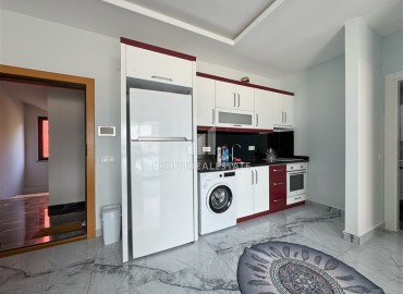 Уютная квартира с одной спальней, 55м² в современной резиденции с хорошей инфраструктурой в Махмутларе, Алания ID-18920 фото-5