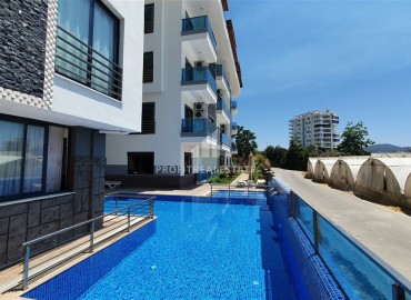 Уютная квартира с одной спальней, 55м² в современной резиденции с хорошей инфраструктурой в Махмутларе, Алания ID-18920 фото-12