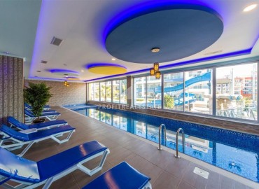 Укомплектованная двухкомнатная квартира, 65м², в комплексе премиум класса в 200м от моря в районе Кестель, Алания ID-18923 фото-15