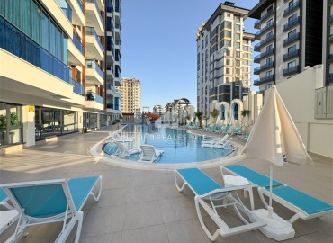 Квартира с одной спальней, 54м², на высоком этаже в элитной резиденции в Махмутларе, Алания, в 750м от моря ID-18926 фото-1