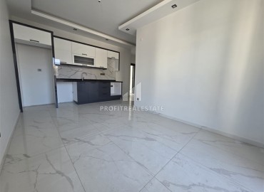 Апартаменты с одной спальней, 55м², в новостройке с хорошей инфраструктурой в 600м от моря в Махмутларе, Алания ID-18955 фото-1