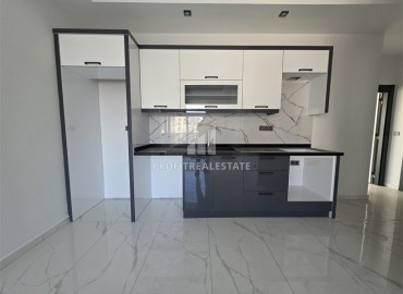 Апартаменты с одной спальней, 55м², в новостройке с хорошей инфраструктурой в 600м от моря в Махмутларе, Алания ID-18955 фото-3