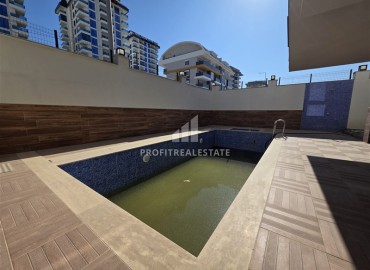 Апартаменты с одной спальней, 55м², в новостройке с хорошей инфраструктурой в 600м от моря в Махмутларе, Алания ID-18955 фото-17