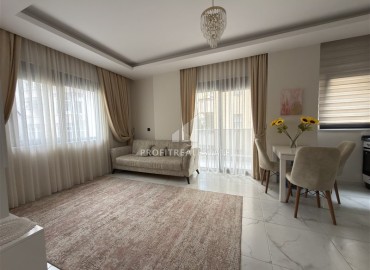 Элегантная квартира с одной спальней, 55м². в новостройке в районе вторничного рынка в Махмутларе, Алания ID-18957 фото-2