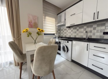 Элегантная квартира с одной спальней, 55м². в новостройке в районе вторничного рынка в Махмутларе, Алания ID-18957 фото-3