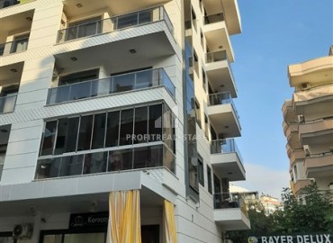 Элегантная квартира с одной спальней, 55м². в новостройке в районе вторничного рынка в Махмутларе, Алания ID-18957 фото-11