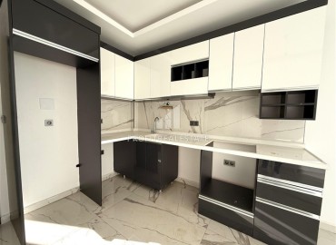 Недорогая квартира с одной спальней, 55м². в новостройке с обширной инфраструктурой в районе Махмутлар, Алания ID-18962 фото-4