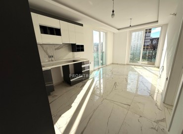 Недорогая квартира с одной спальней, 55м². в новостройке с обширной инфраструктурой в районе Махмутлар, Алания ID-18962 фото-5