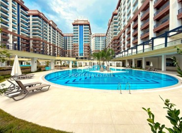 Элитная надвижимость в Махмутларе, Алания: двухкомнатные апартаменты, 68м², с видом на горы в фешенебельном комплексе ID-18970 фото-1