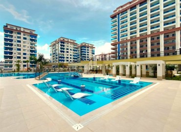 Элитная надвижимость в Махмутларе, Алания: двухкомнатные апартаменты, 68м², с видом на горы в фешенебельном комплексе ID-18970 фото-16