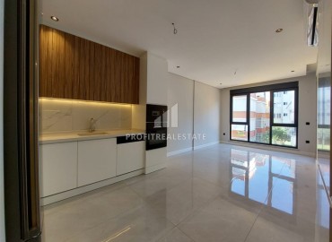 Апартаменты с одной спальней, 55м², с бытовой техникой в новостройке с бассейном у пляжа Клеопатры, Алания ID-18980 фото-5