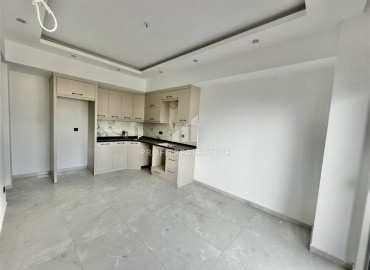 Трехкомнатные апартаменты с видом на море и горы, 68м², в малоквартирном комплексе в районе Алании - Оба ID-18986 фото-2