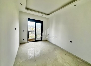 Трехкомнатные апартаменты с видом на море и горы, 68м², в малоквартирном комплексе в районе Алании - Оба ID-18986 фото-7