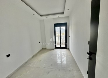 Трехкомнатные апартаменты с видом на море и горы, 68м², в малоквартирном комплексе в районе Алании - Оба ID-18986 фото-9