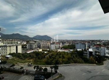 Трехкомнатные апартаменты с видом на море и горы, 68м², в малоквартирном комплексе в районе Алании - Оба ID-18986 фото-14