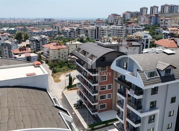 Трехкомнатные апартаменты с видом на море и горы, 68м², в малоквартирном комплексе в районе Алании - Оба ID-18986 фото-15