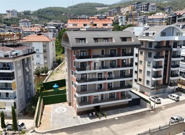 Трехкомнатные апартаменты с видом на море и горы, 68м², в малоквартирном комплексе в районе Алании - Оба ID-18986 фото-16