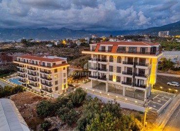 Апартаменты с одной спальней, 55м², в комфортабельной резиденции с отельной инфраструктурой в районе Кестель, Алания ID-18992 фото-1