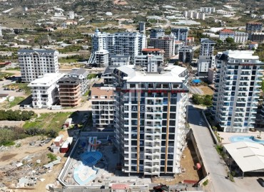 Двухкомнатные апартаменты, 51,3м², в элитном комплексе на этапе строительства, в Махмутларе, Алания ID-17654 фото-2