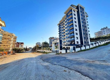 Выгодное предложение: новая квартира с одной спальней, 50м², в новостройке премиум класса в Авсалларе, Алания ID-19006 фото-1