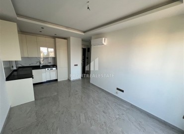 Двухкомнатная квартира, 53м², с чистовой отделкой в комфортабельной новостройке в центре Алании, в 300м от моря ID-19010 фото-2