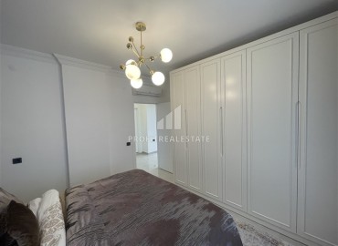 Элитная двухкомнатная квартира, 95м², на первой береговой линии с видом на Аланийскую крепость в районе Тосмур, Алания ID-19019 фото-15