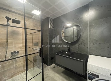 Элитная двухкомнатная квартира, 95м², на первой береговой линии с видом на Аланийскую крепость в районе Тосмур, Алания ID-19019 фото-18