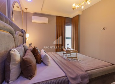 Видовая дизайнерская квартира 1+1, 55м², в элитном комплексе на первой береговой линии в Махмутларе, Алания ID-19032 фото-8