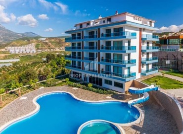 Видовые двухкомнатные апартаменты, 56м², в комплексе премиум класса в горах района Каргыджак, Алания ID-19033 фото-1