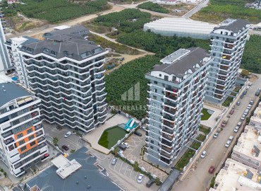 Новая двухуровневая квартира 3+1, 105м², в комплексе премиум класса в центре Махмутлара, в 400м от моря, Алания ID-19042 фото-1