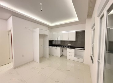 Апартаменты с двумя спальнями, 80м², в новостройке с бассейном на центральной улице Махмутлара, Алания ID-19045 фото-2