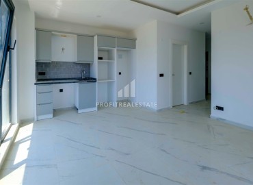 Двухкомнатные апартаменты, 50м², в новом комплексе премиум класса в центре Махмутлара, Алания ID-19047 фото-4