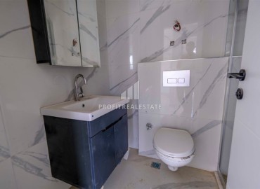 Двухкомнатные апартаменты, 50м², в новом комплексе премиум класса в центре Махмутлара, Алания ID-19047 фото-7