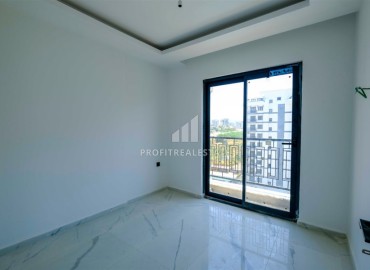 Двухкомнатные апартаменты, 50м², в новом комплексе премиум класса в центре Махмутлара, Алания ID-19047 фото-8