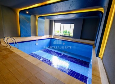 Двухкомнатные апартаменты, 50м², в новом комплексе премиум класса в центре Махмутлара, Алания ID-19047 фото-17