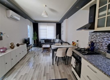 Меблированная двухкомнатная квартира с остекленным балконом, 52м², в 300м от моря в районе Оба, Алания ID-19048 фото-2