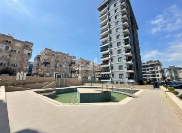 Новые апартаменты с одной спальней, 55м², в элитной резиденции в Махмутларе, Алания, 600м от моря ID-19053 фото-1