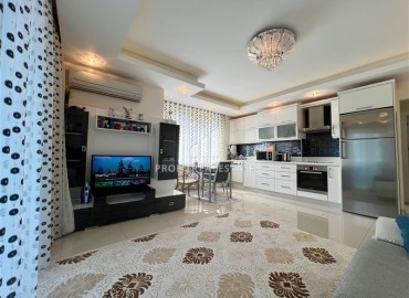 Симпатичная двухкомнатная квартира, 70м², с видом на горы в 200м от моря в Махмутларе, Алания ID-19088 фото-2