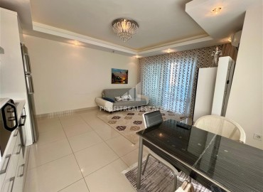 Симпатичная двухкомнатная квартира, 70м², с видом на горы в 200м от моря в Махмутларе, Алания ID-19088 фото-3